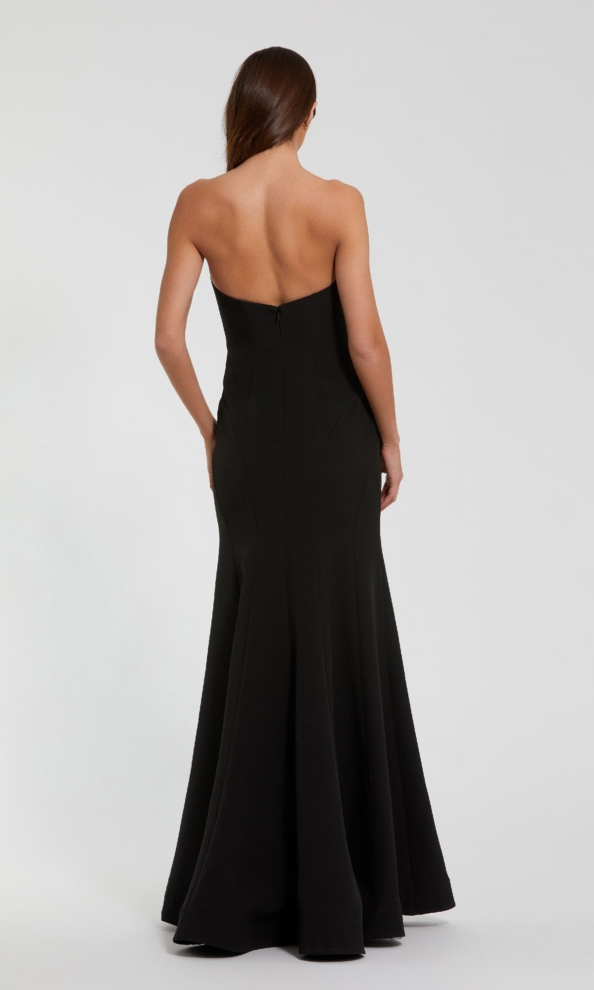 Black strapless gown on a white background